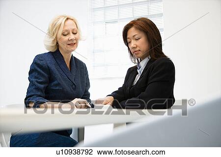 Businesswomen communicating View Large Photo Image Stock Image - Businesswomen communicating. Fotosearch