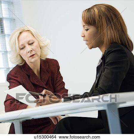 Businesswomen in meeting View Large Photo Image Picture - Businesswomen in meeting. Fotosearch
