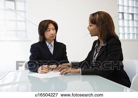 Businesswomen in office View Large Photo Image Stock Photo - Businesswomen in office. Fotosearch