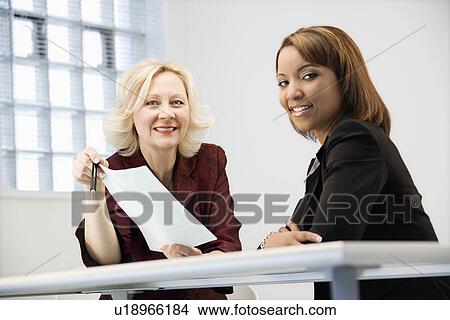 Picture - Businesswomen smiling. Fotosearch