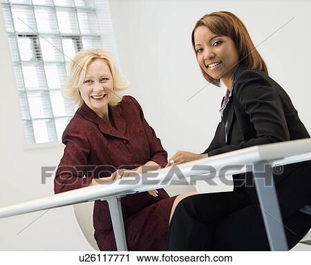 Stock Image - Businesswomen smiling. Fotosearch