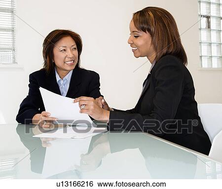 Stock Photograph - Businesswomen smiling. Fotosearch