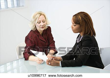 Businesswomen working View Large Photo Image Stock Photo - Businesswomen working. Fotosearch