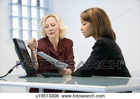 Businesswomen working View Large Photo Image Stock Photograph - Businesswomen working. Fotosearch