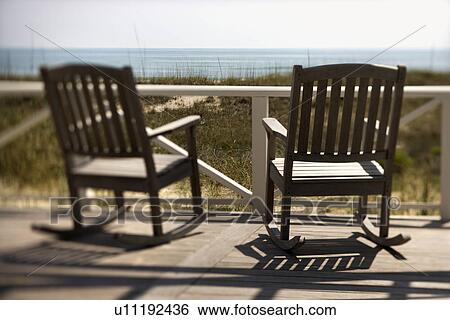 Chairs on Porch Facing Beach View Large Photo Image Stock Photograph - Chairs on Porch Facing Beach. Fotosearch