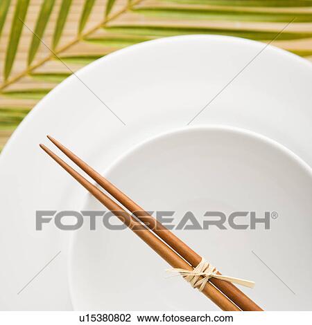 Stock Image - Chopsticks on an Empty Bowl. Fotosearch