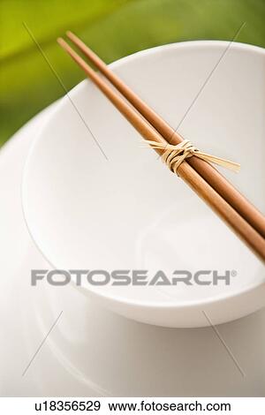 Chopsticks on an Empty Bowl View Large Photo Image Stock Photo - Chopsticks on an Empty Bowl. Fotosearch