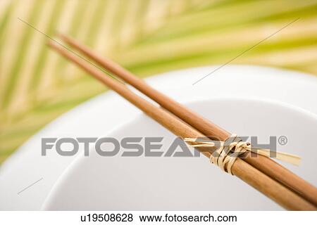 Chopsticks on an Empty Bowl View Large Photo Image Stock Photo - Chopsticks on an Empty Bowl. Fotosearch