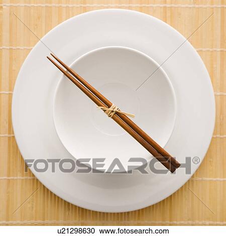 Stock Image - Chopsticks With Empty Bowl and Plate. Fotosearch