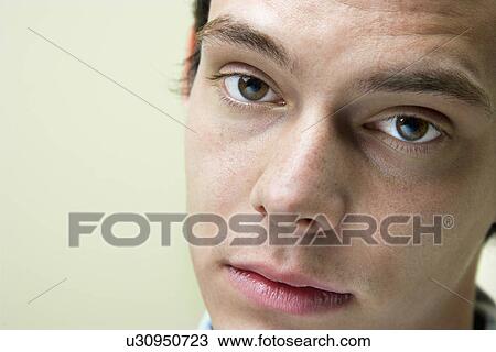 Stock Image - Close up of young man. Fotosearch