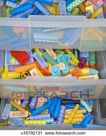 Stock Image - Colorful Hair Curlers in Drawer. Fotosearch