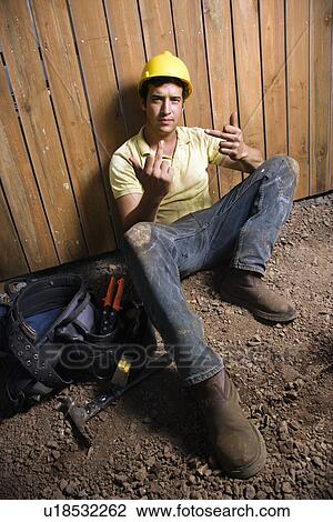 Stock Image - Construction Worker Gives the Bird. Fotosearch
