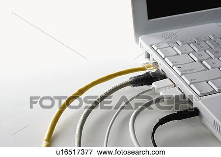 Stock Photo - Cords Plugged Into Laptop Computer. Fotosearch