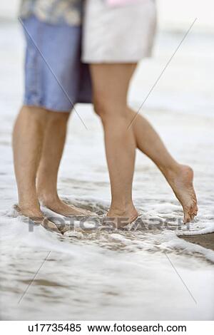 Stock Photography - Couple at the Beach. Fotosearch
