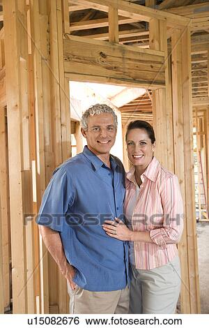 Couple Building Home View Large Photo Image Stock Photograph - Couple Building Home. Fotosearch