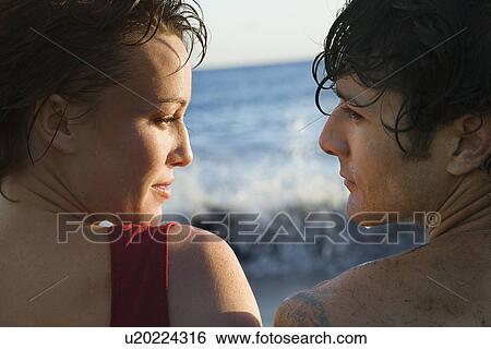 Stock Photograph - Couple By the Ocean. Fotosearch