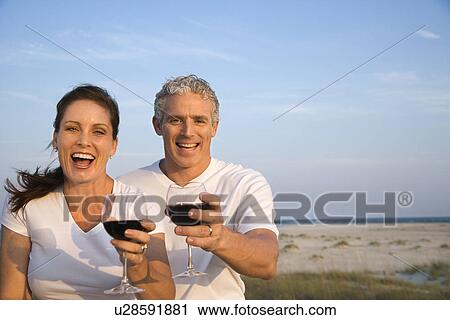 Couple Drinking Wine on Beach View Large Photo Image Stock Image - Couple Drinking Wine on Beach. Fotosearch