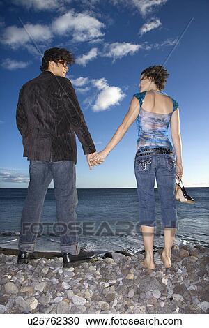 Couple Holding Hands on Beach View Large Photo Image Stock Image - Couple Holding Hands on Beach. Fotosearch