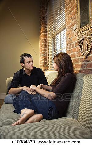 Stock Image - Couple holding hands. Fotosearch