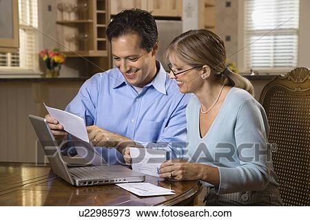 Couple Paying Bills Online View Large Photo Image Stock Image - Couple Paying Bills Online. Fotosearch