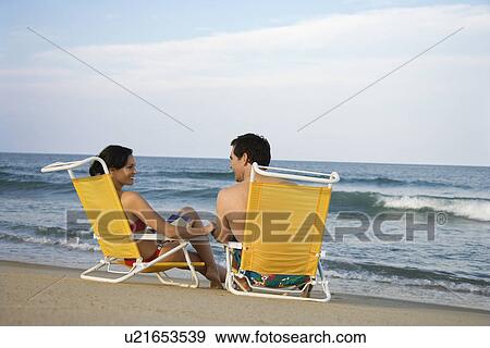 Couple Sitting on Beach View Large Photo Image Stock Photo - Couple Sitting on Beach. Fotosearch