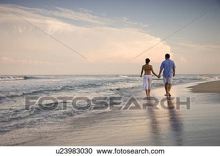 Couple Walking on Beach View Large Photo Image Stock Image - Couple Walking on Beach. Fotosearch