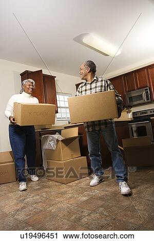 Couple With Moving Boxes View Large Photo Image Stock Image - Couple With Moving Boxes. Fotosearch