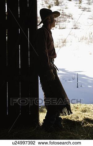 Cowboy Leaning in Doorway of Barn View Large Photo Image Stock Image - Cowboy Leaning in Doorway of Barn. Fotosearch