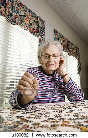 Elderly Woman Doing Jig Saw Puzzle View Large Photo Image Stock Image - Elderly Woman Doing Jig Saw Puzzle. Fotosearch