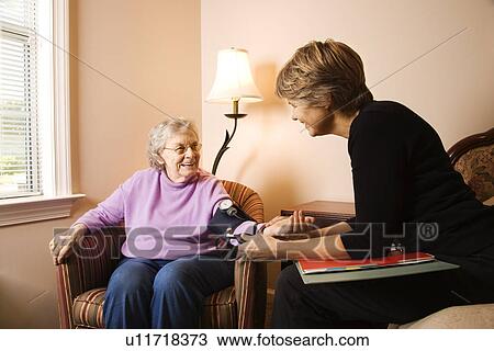 Elderly Woman Having Blood Pressure Taken View Large Photo Image Stock Image - Elderly Woman Having Blood Pressure Taken. Fotosearch