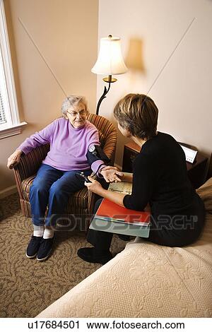 Elderly Woman Having Blood Pressure Taken View Large Photo Image Stock Image - Elderly Woman Having Blood Pressure Taken. Fotosearch