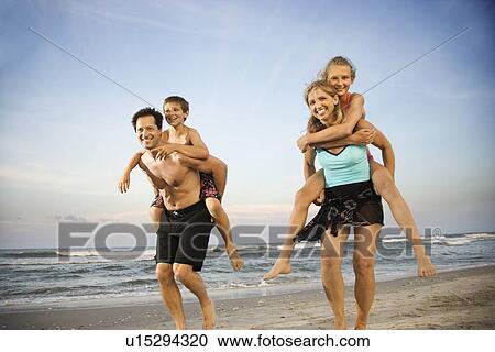 Stock Image - Family at the Beach. Fotosearch