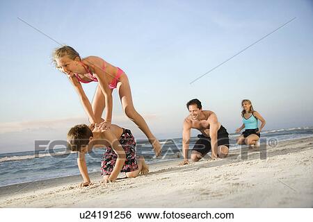 Family at the beach View Large Photo Image Stock Photograph - Family at the beach. Fotosearch