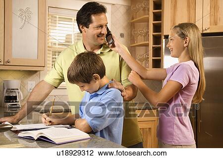 Stock Image - Family in Kitchen. Fotosearch