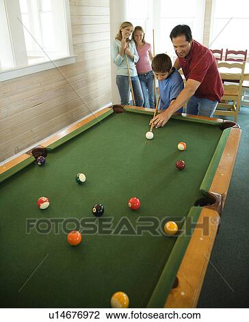 Stock Image - Family Playing Pool. Fotosearch