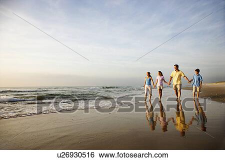 Family Walking on Beach View Large Photo Image Stock Photograph - Family Walking on Beach. Fotosearch