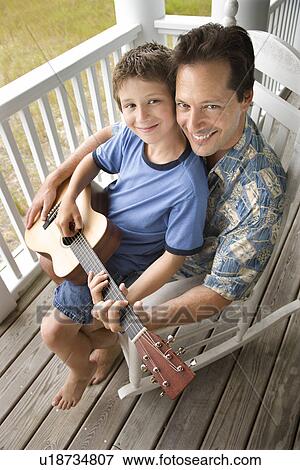Father and Son on Porch Playing Guitar View Large Photo Image Stock Photo - Father and Son on Porch Playing Guitar. Fotosearch