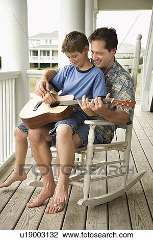 Father and Son Playing Guitar View Large Photo Image Stock Image - Father and Son Playing Guitar. Fotosearch