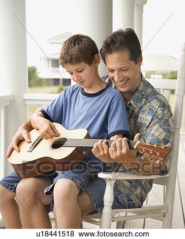 Father and Son Playing Guitar View Large Photo Image Stock Photo - Father and Son Playing Guitar. Fotosearch