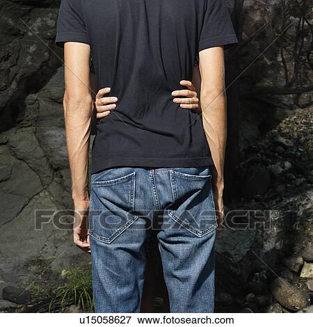Stock Photo - Female Holding Male Around Waist. Fotosearch