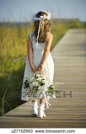 Stock Image - Flower Girl on Boardwalk. Fotosearch
