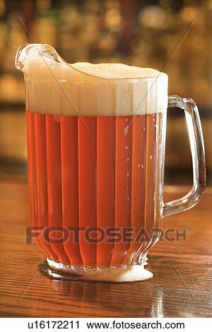 Stock Image - Full Pitcher of Beer. Fotosearch