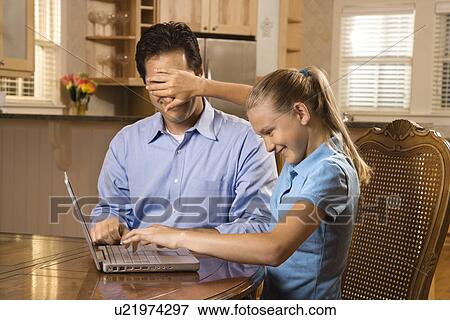 Girl covering Father's eyes. View Large Photo Image Stock Photo - Girl covering Father's eyes.. Fotosearch