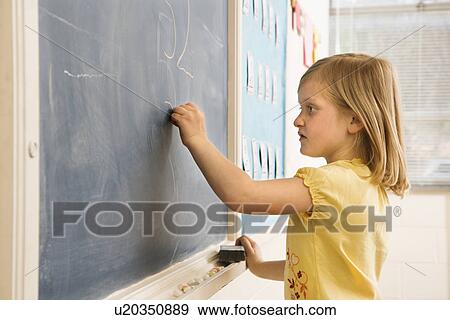 Stock Photo - Girl Doing Math on Blackboard. Fotosearch