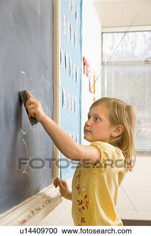 Girl Erasing Writing on Blackboard View Large Photo Image Stock Image - Girl Erasing Writing on Blackboard. Fotosearch