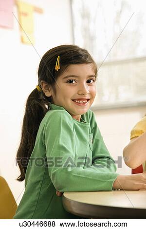 Stock Photo - Girl in Classroom. Fotosearch