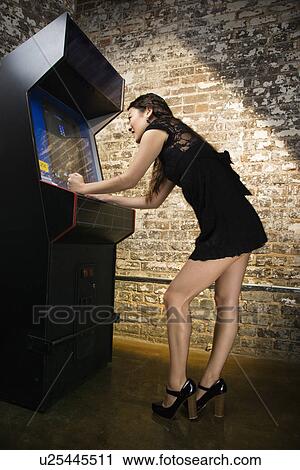 Girl playing video game View Large Photo Image Stock Image - Girl playing video game. Fotosearch