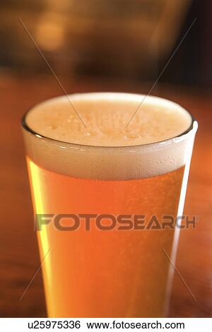 Stock Photograph - Glass of Beer With Foam. Fotosearch