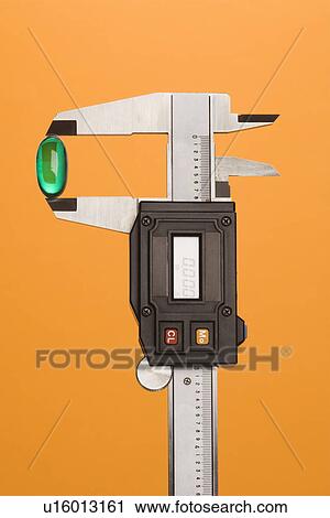 Green Capsule in Caliper View Large Photo Image Stock Image - Green Capsule in Caliper. Fotosearch