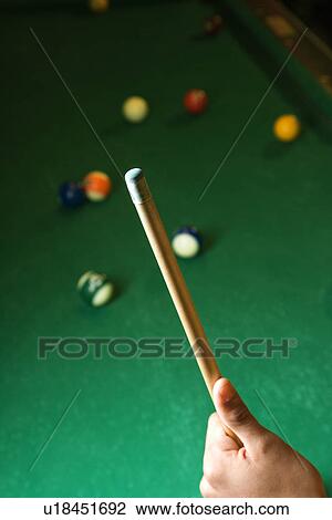 Stock Image - Hand Holding Pool Cue. Fotosearch